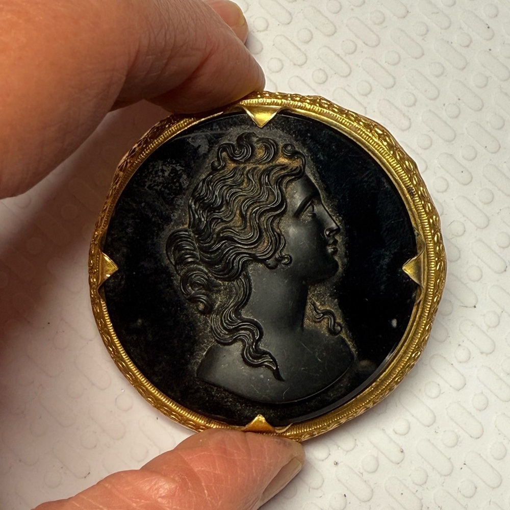 45.)Black and Gold Cameo Brooch